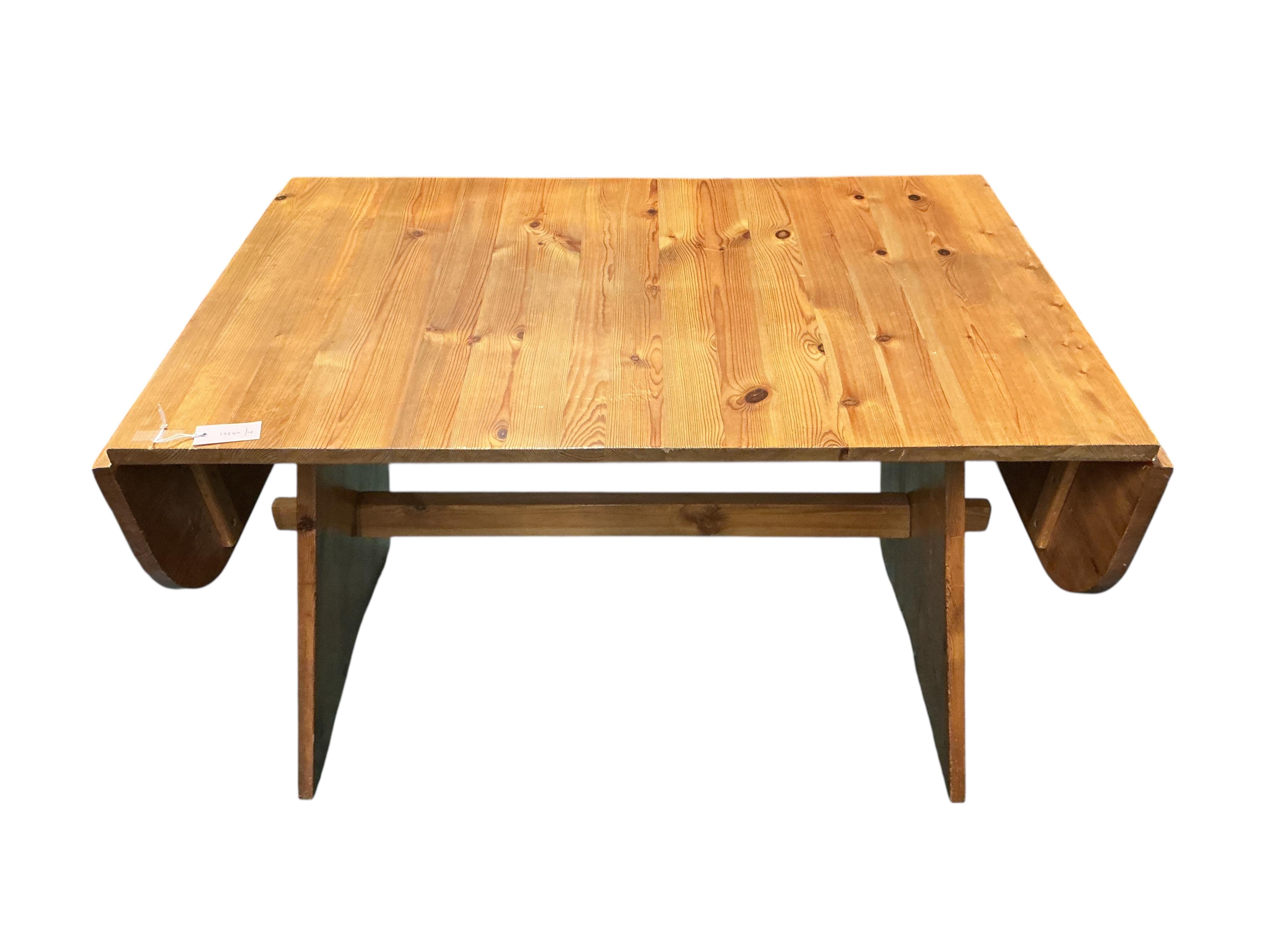 A Spanish style pine drop flap dining table, width 120cm, depth 78cm, height 75cm